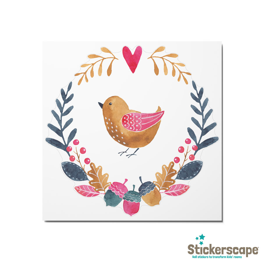 multicoloured woodland window sticker (Option 1), autumn window stickers. Gold bird in middle of a wreath made of blue, green and pink leaves and acorns with pink heart at the top.