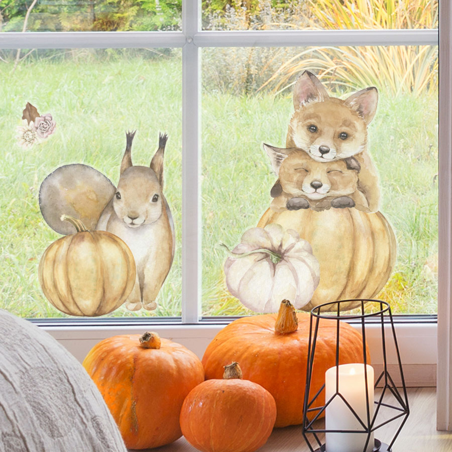 pumpkin and woodland animal window sticker packs (option 2), autumn window stickers. Squirrel with pumpkin, two foxes resting on top of each other with bottom fox head on pumpkin.