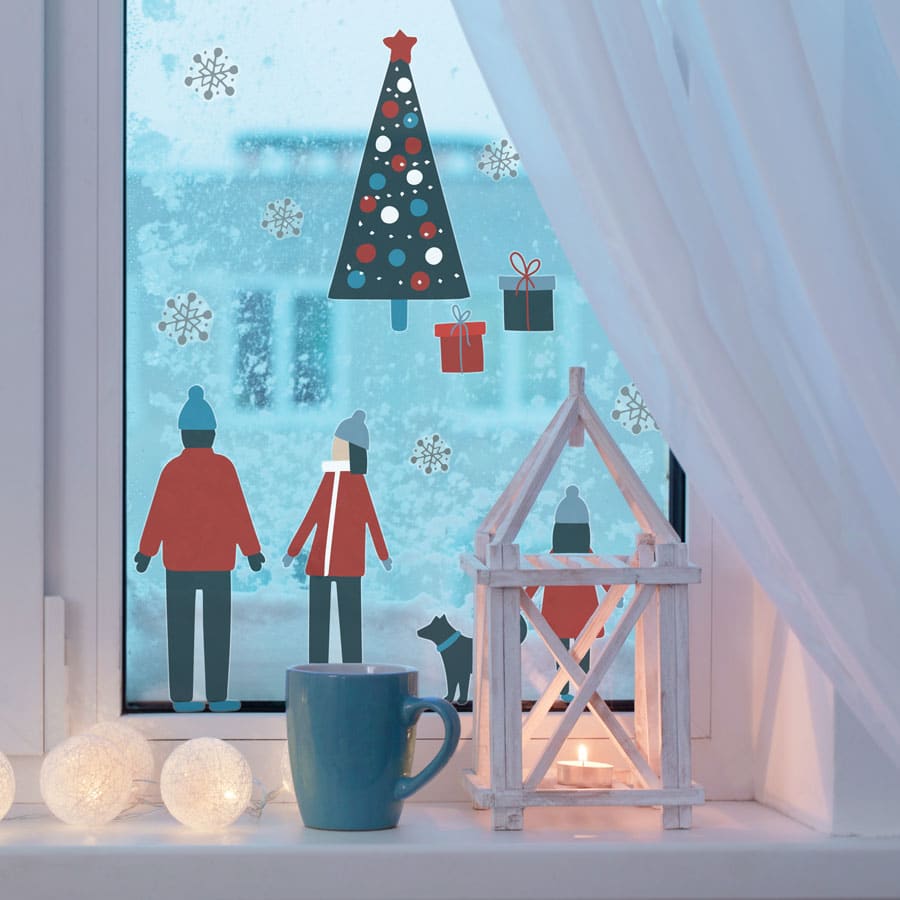 Scandi family winter scene window stickers in a window for Christmas
