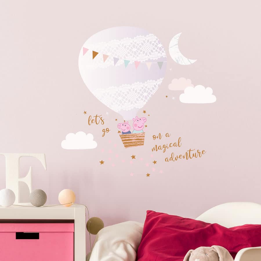 Magical adventure with Peppa wall sticker regular shown on a pink wall behind a white bed and white drawers