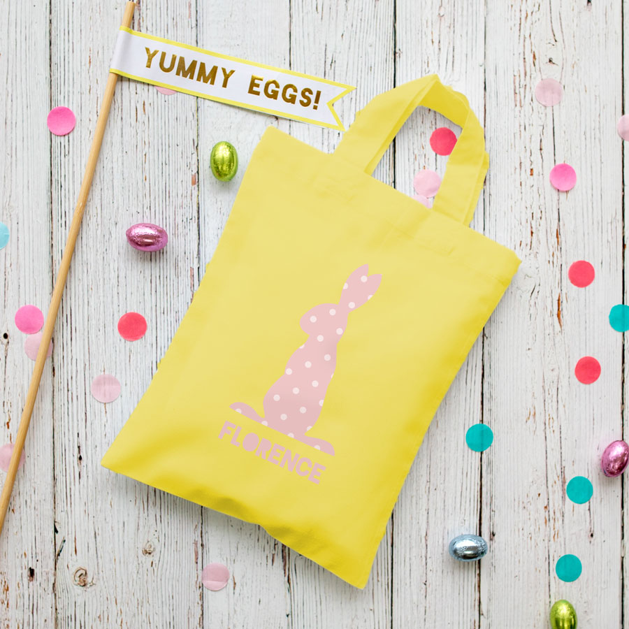 This personalised pink bunny Easter bag in yellow is the perfect way to make your child's Easter egg hunt super special this year