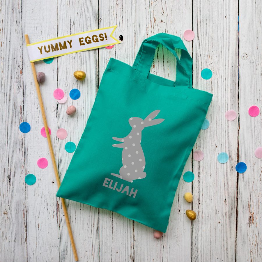 This personalised grey bunny Easter bag in teal is the perfect way to make your child's Easter egg hunt super special this year