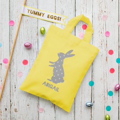 This personalised grey bunny Easter bag in yellow is the perfect way to make your child's Easter egg hunt super special this year