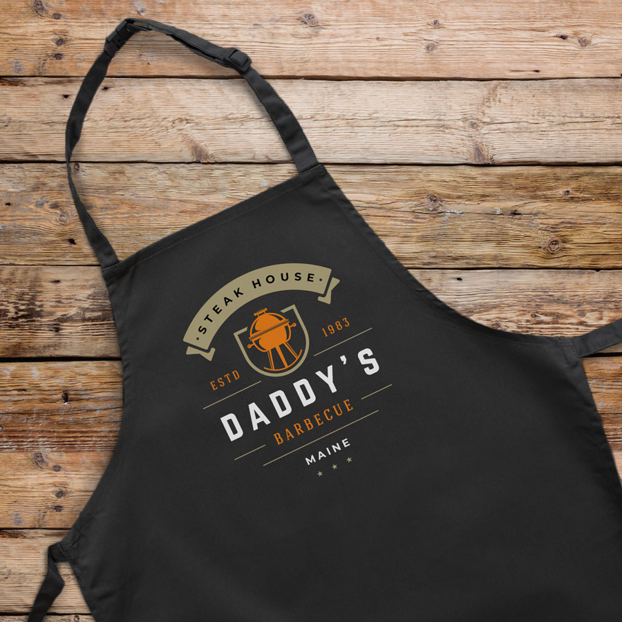 Personalised kettle barbecue apron (Adult) in black is a perfect gift for a brother, father or Grandad on their birthday or as a gift for father's day