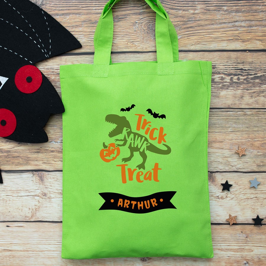Personalised dinosaur trick or treat bag (Green) perfect for Halloween trick or treat featuring a dinosaur and personalised banner
