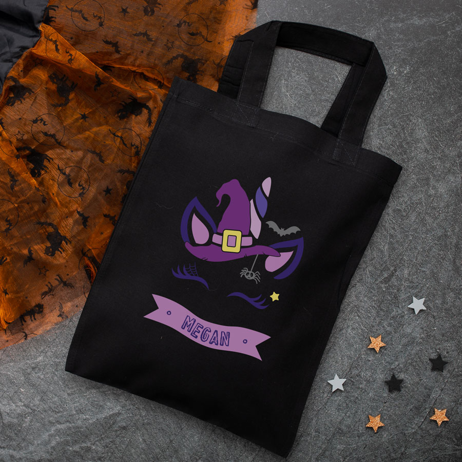 Personalised unicorn witch trick or treat bag (Black) perfect for Halloween trick or treat featuring a unicorn witch and personalised banner