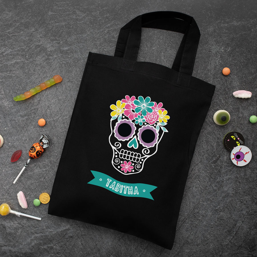 Personalised skull trick or treat bag (Black) perfect for Halloween trick or treat featuring a skull or calavera and personalised banner