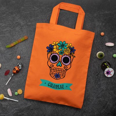 Personalised skull trick or treat bag (Orange) perfect for Halloween trick or treat featuring a skull or calavera and personalised banner