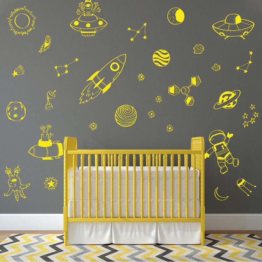 contemporary space wall decals in yellow with rockets, satellites and planets