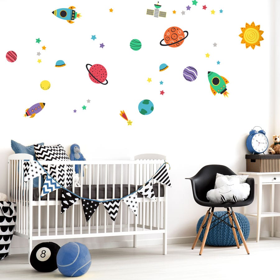 Colourful space wall stickers pack on white wall in a baby's nursery perfect for decorating a space theme