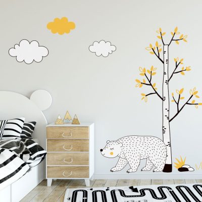 Woodland animal wall sticker scene featuring a tree, bear and clouds all with black, yellow and white accents