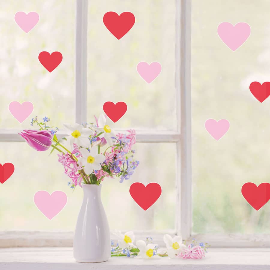 Pink and red heart window stickers with girl smelling flowers perfect for decorating for Valentines Day
