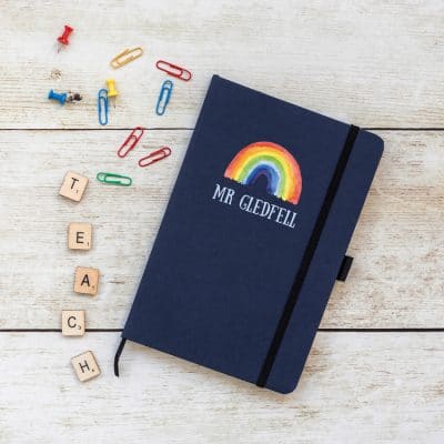 Personalised rainbow notebook in blue features a rainbow design with personalised name underneath and is a perfect gift for a teacher or teaching assistant to say thank you