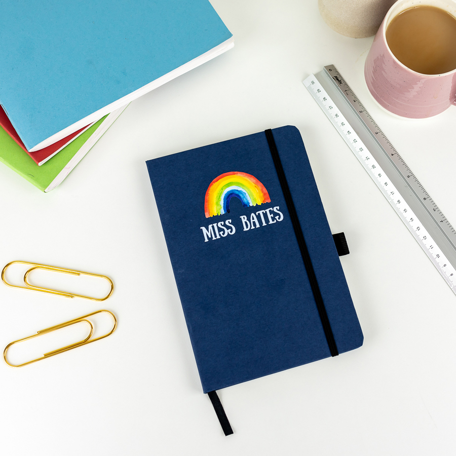 Personalised rainbow notebook in blue features a rainbow design with personalised name underneath and is a perfect gift for a teacher or teaching assistant to say thank you