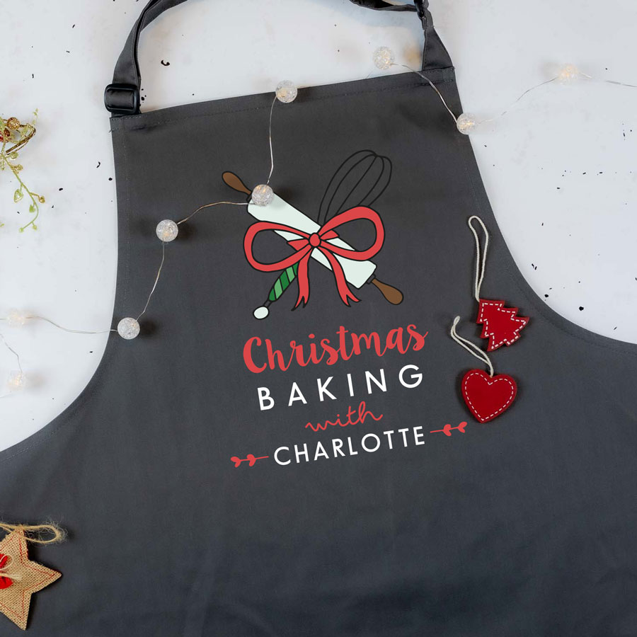 Christmas Baking with apron in grey featuring whisk and rolling pin