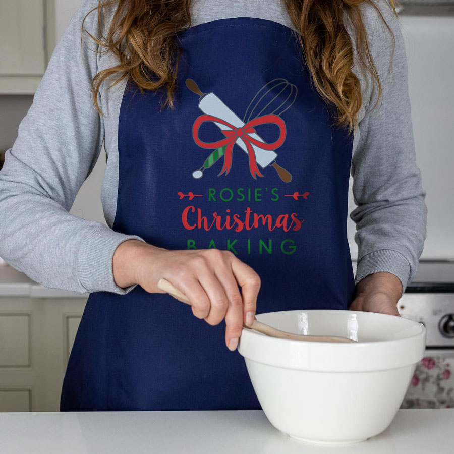 Christmas Baking apron in navy featuring whisk and rolling pin