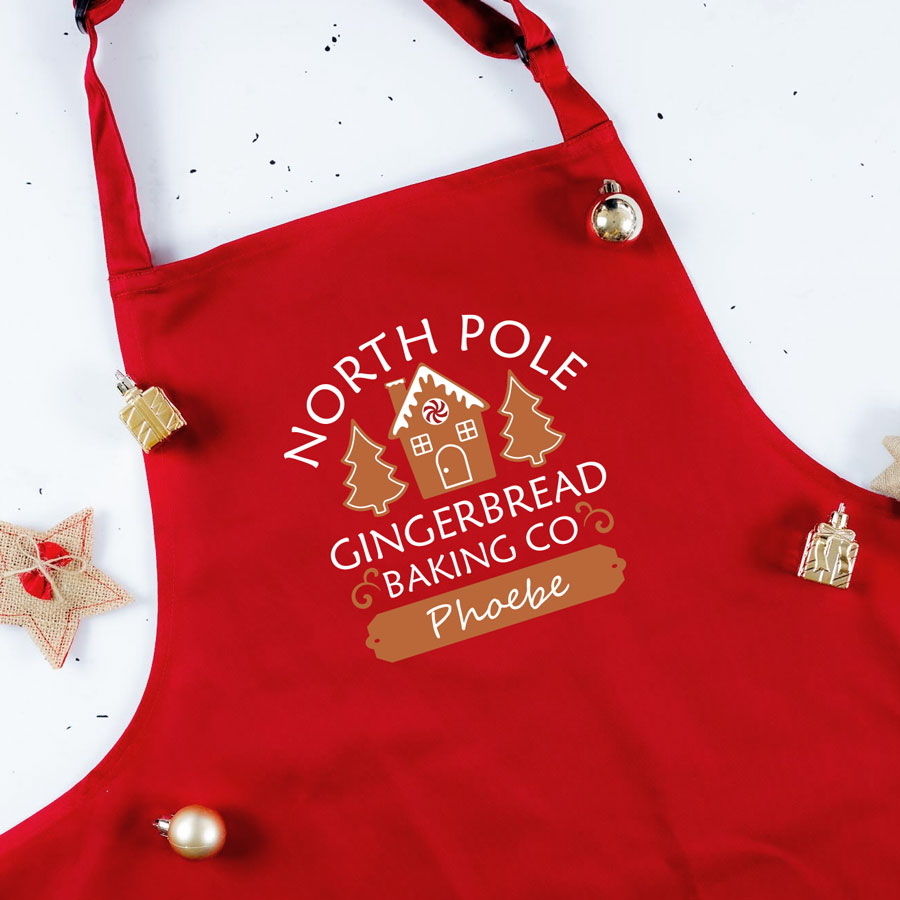 Gingerbread Baking Co apron in red personalised with a name of your choice a perfect gift for Christmas baking