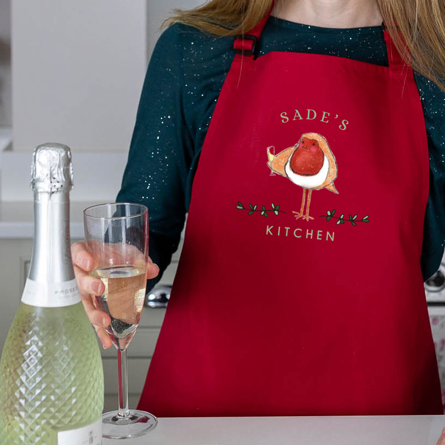 Festive robin apron in red personalised with a name perfect for baking at Christmas