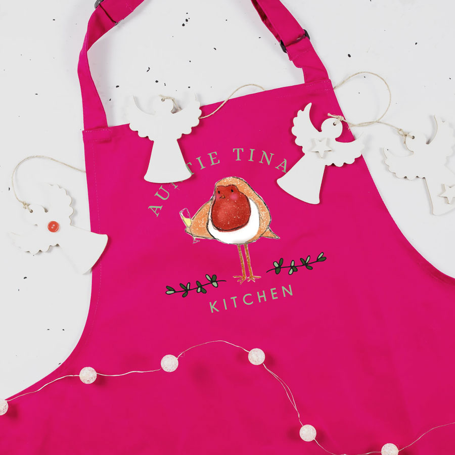 Festive robin apron in pink personalised with a name perfect for baking at Christmas