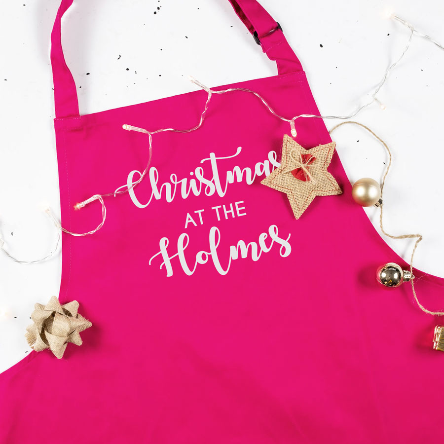 Personalised Christmas family apron in pink with personalised text perfect baking and cooking at Christmas