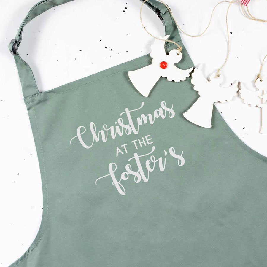 Personalised Christmas family apron in sage with personalised text perfect baking and cooking at Christmas