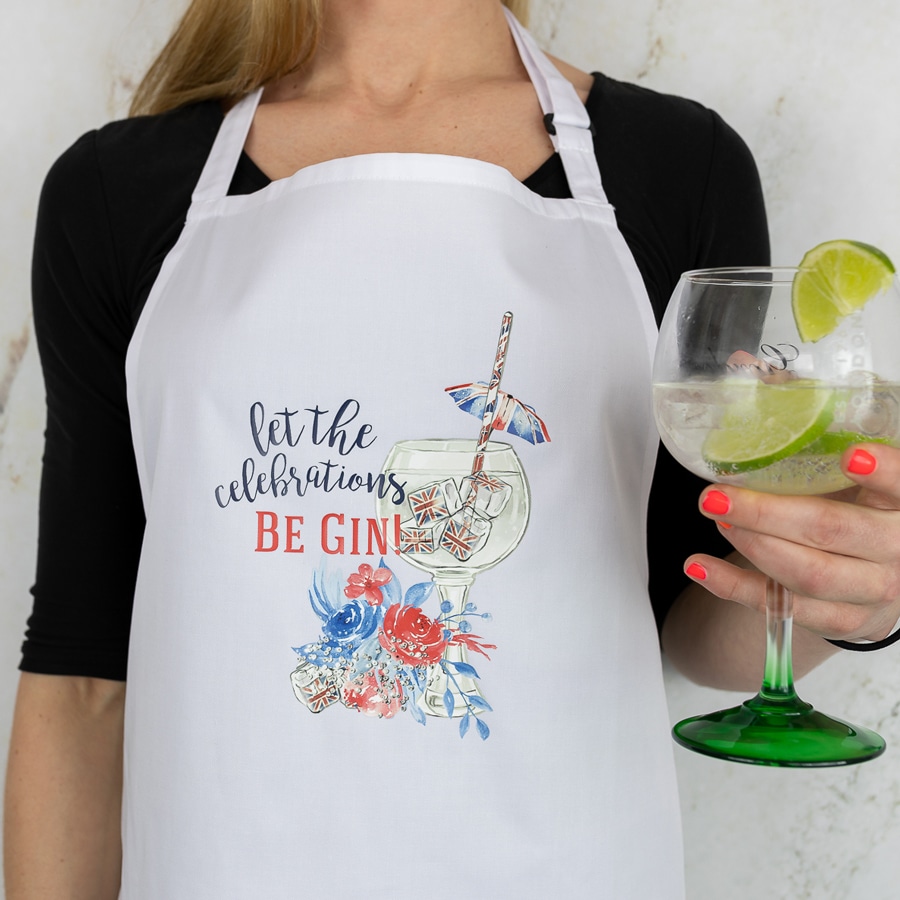 Be gin apron shown on model holding a glass with lime and ice
