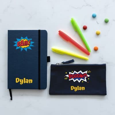 Comic book back to school mini bundle. Includes black notebook with the name Dylan in yellow on and yellow and blue star explosion with the word BAM! in red. Black Pencil case with name in yellow and the word POOOW!! in a blue and white star explosion.