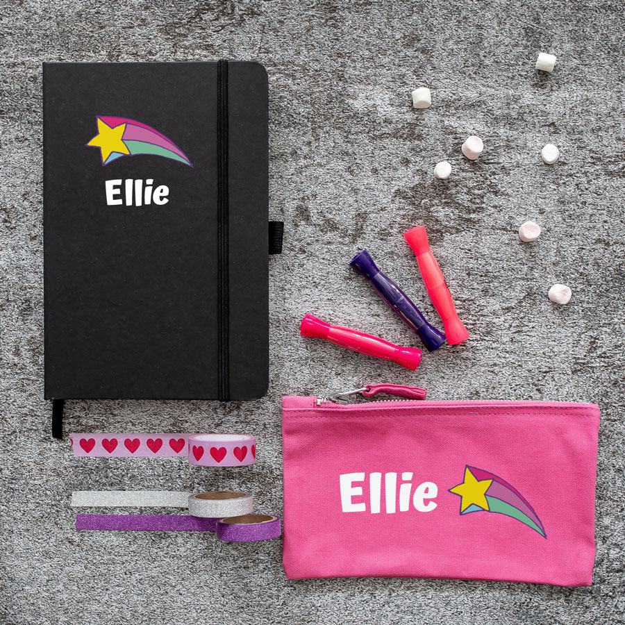 Mini Retro doodles back to school bundle featuring a black notebook and pink pencil case. With the name Ellie in white with a pink yellow and blue shooting star.