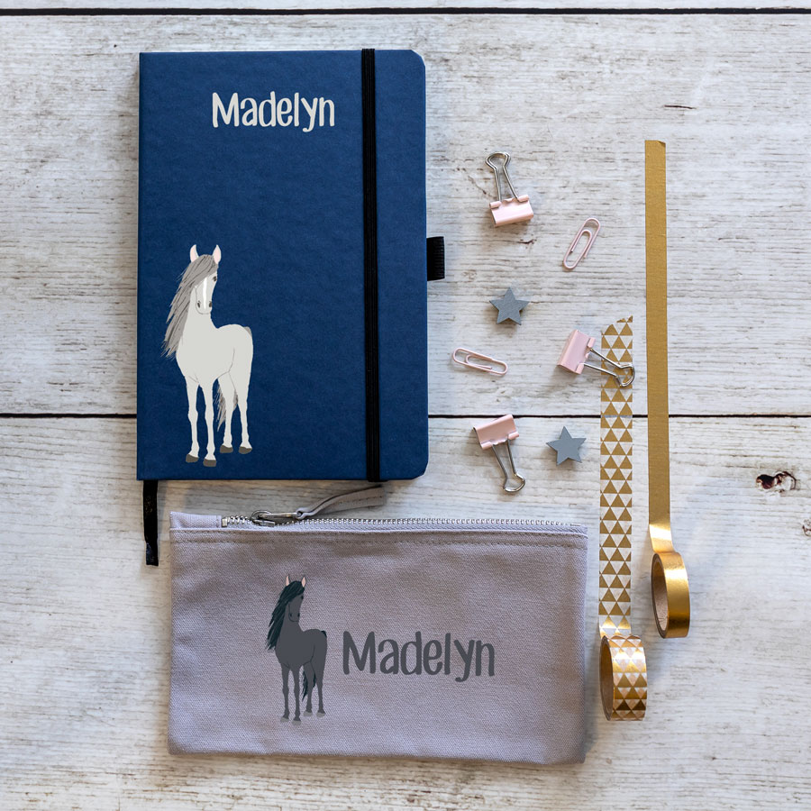 Horse back to school mini bundles. blue notebook with horse illustration bottom left with name text in white at top centre. grey pencil case with image of horse on left with name text in white to the right.