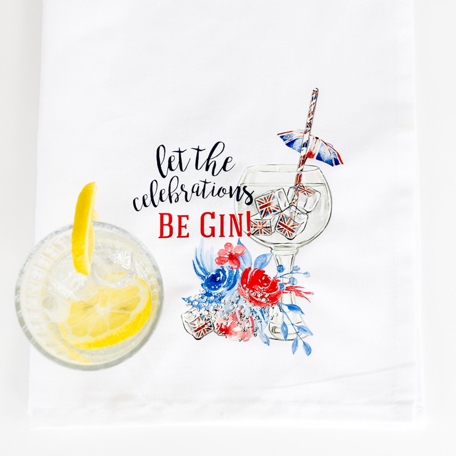 Be gin tea towel flat with a glass of ice and lemon