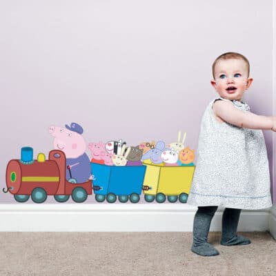 Peppa Pig and Friends Train Wall Sticker on a purple bedroom wall with child