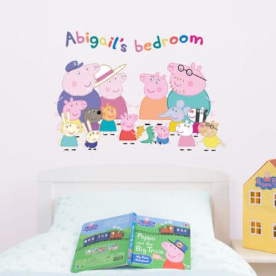 Personalised Peppa Pig and Family Wall Sticker (Regular size) on a bedroom wall above a Peppa Pig themed bed