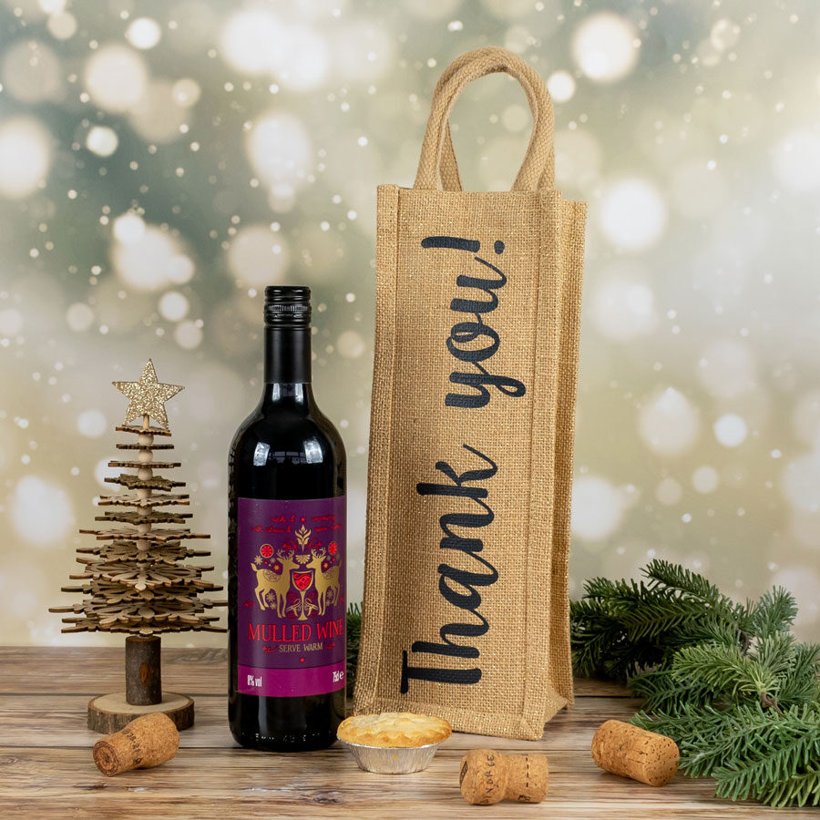 Thank you bottle bag shown next to a bottle of mulled wine
