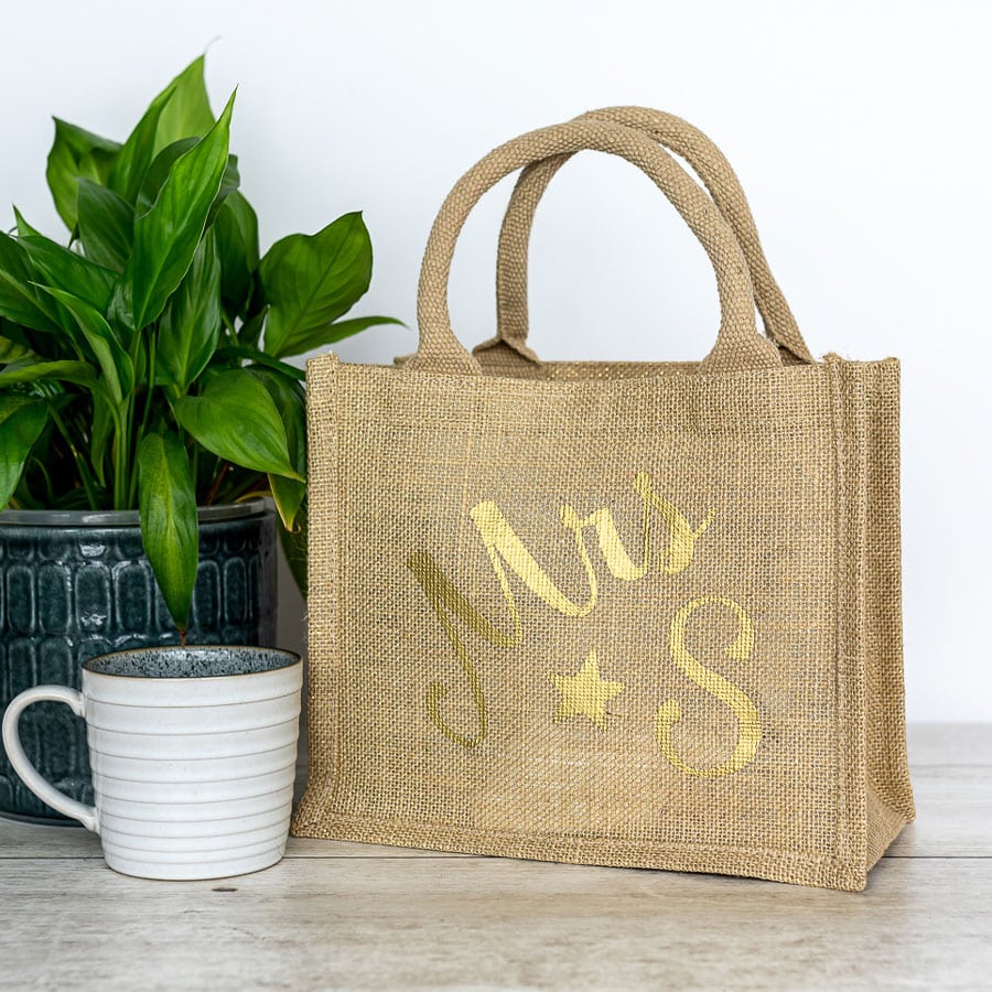 Stickerscape Initial Jute Bag for Teachers, gold text on shimmer bag.