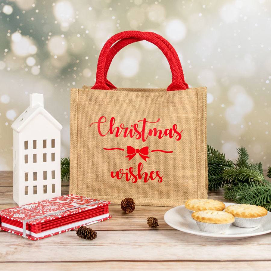 christmas wishes jute bag shown with a plate of mince pies