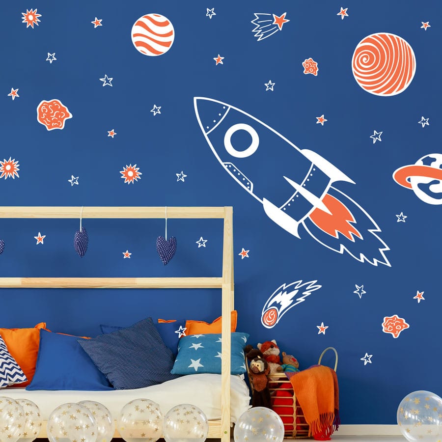 Rocket and Stars Wall Sticker Pack white on a blue wall
