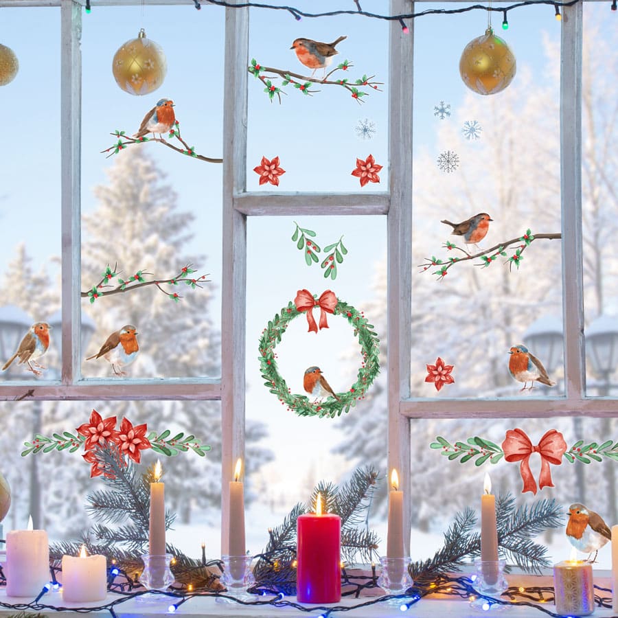 christmas robin window stickers (Large pack) on a window with winter decor in the window frame