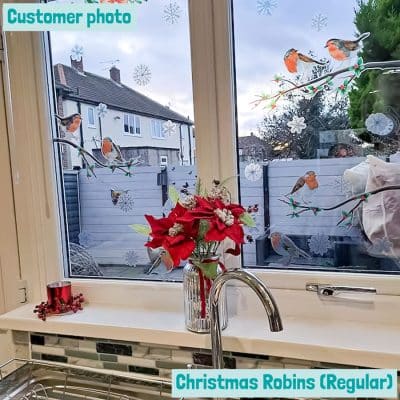 customer photo showing christmas robin window stickers (regular pack) on a kitchen window