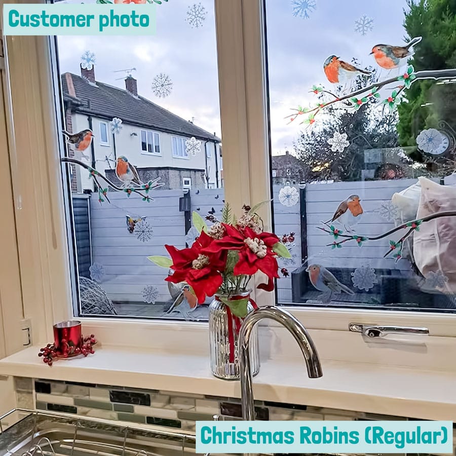 customer photo showing christmas robin window stickers (regular pack) on a kitchen window
