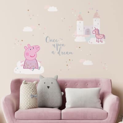 once upon a time Peppa pig wall sticker shown on a light beige wall behind a pink sofa