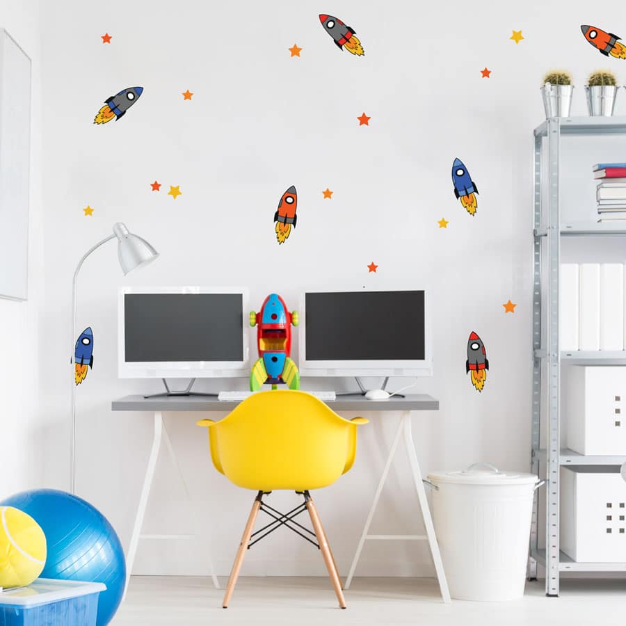 colourful space rocket wall stickers above a child's desk