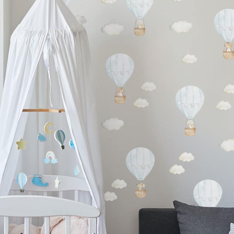 blue hot air balloon wall stickers in a nursery on a grey wall