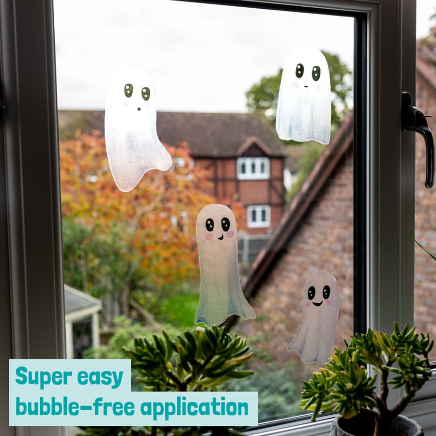 cute white ghost window stickers on a window showing bubble free application