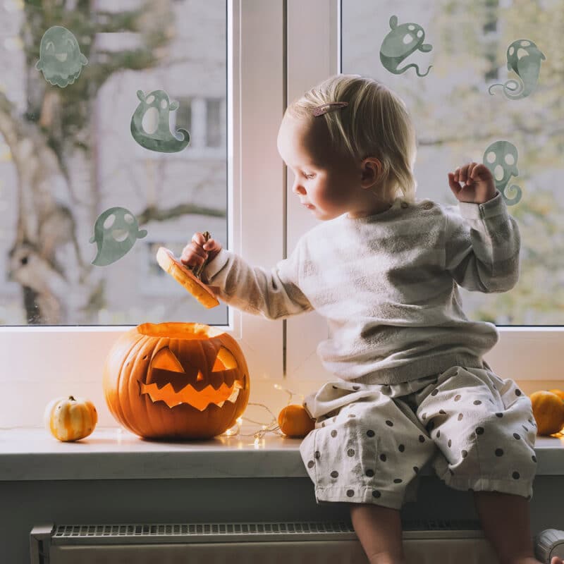 Ghost Window Stickers on window behind child