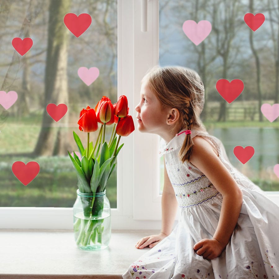 Pink and red heart window stickers with girl smelling flowers perfect for decorating for Valentines Day
