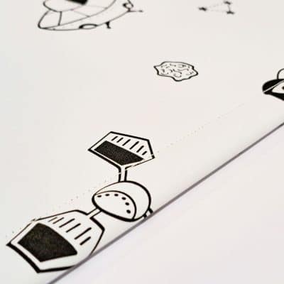 monochrome space roller blind with close-up of bottom bar stitching