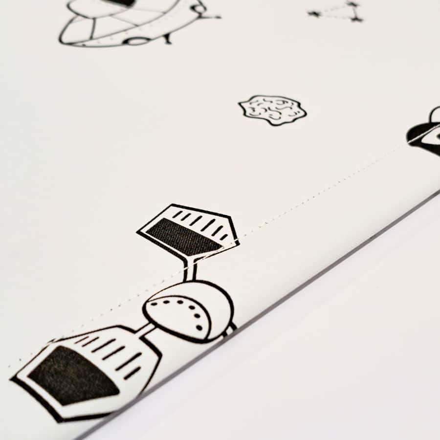 monochrome space roller blind with close-up of bottom bar stitching
