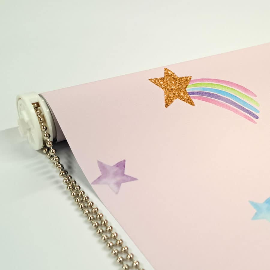 close-up of pink shooting star roller blind with blind mechanism and a chrome chain
