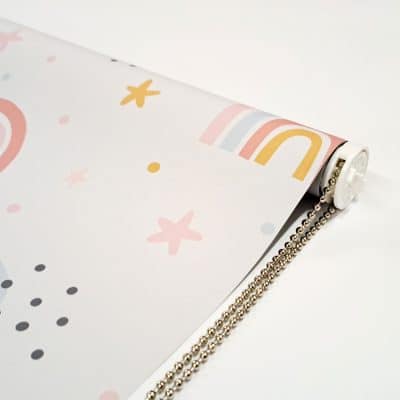 close-up of grey rainbows and stars roller blind showing chain mechanism with chrome chain