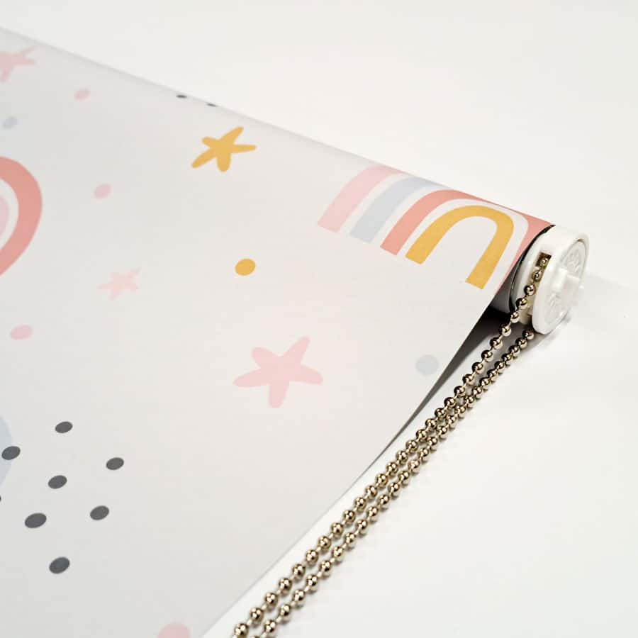 close-up of grey rainbows and stars roller blind showing chain mechanism with chrome chain